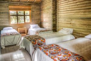 Postel nebo postele na pokoji v ubytování HOTEL IGUAIMA