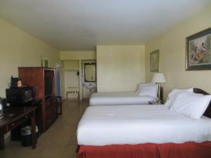 Katil atau katil-katil dalam bilik di Flagship Inn