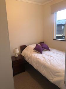 Postel nebo postele na pokoji v ubytování Arriendo casa en Pucón, Condominio Los Robles II