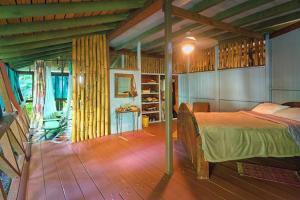 Letto o letti in una camera di Cocoa Cottage