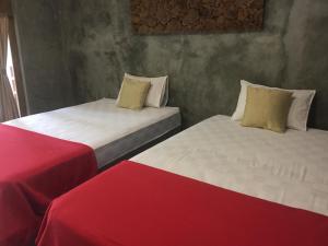 Ein Bett oder Betten in einem Zimmer der Unterkunft Watukarung Ristu Homestay
