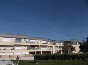 an apartment building with a lot of balconies at villa marine 2 in Jullouville-les-Pins