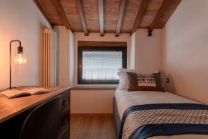 Ліжко або ліжка в номері Santa Trinita - Flo Apartments
