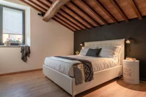 Ліжко або ліжка в номері Santa Trinita - Flo Apartments