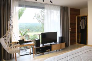 TV a/nebo společenská místnost v ubytování NANO Eco-Hostel