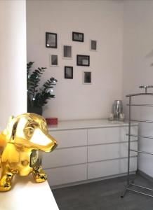 a gold elephant statue sitting on a table in a room at ROYAL APARTMAN in Berekfürdő