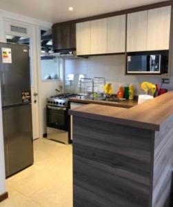 Kuchyň nebo kuchyňský kout v ubytování Arriendo casa en Pucón, Condominio Los Robles II