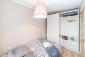 Ένα ή περισσότερα κρεβάτια σε δωμάτιο στο Apartament Graniczna 6