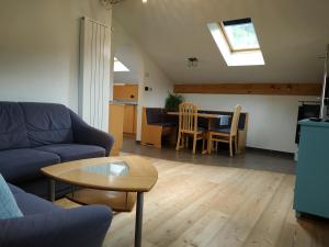 a living room with a couch and a table at Apartments Blumenheim in Castelrotto