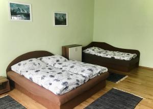 Postel nebo postele na pokoji v ubytování Ubytovanie Veľká Lomnica