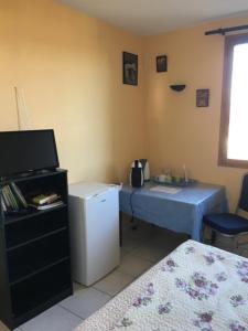 Postel nebo postele na pokoji v ubytování Les Orchidées