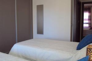 Posteľ alebo postele v izbe v ubytovaní Edificio Alteanos V