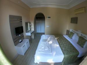 TV a/nebo společenská místnost v ubytování Bellamaritimo Hotel