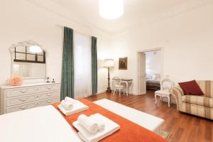 a bedroom with a bed and a living room at Leonardo Suite Pantheon in Rome