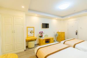 TV a/nebo společenská místnost v ubytování The Grace Hotel