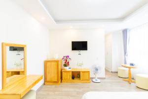 TV a/nebo společenská místnost v ubytování The Grace Hotel