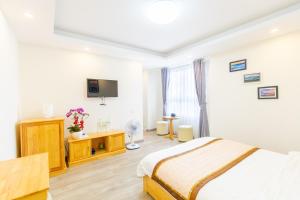 TV a/nebo společenská místnost v ubytování The Grace Hotel