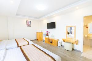 TV a/nebo společenská místnost v ubytování The Grace Hotel