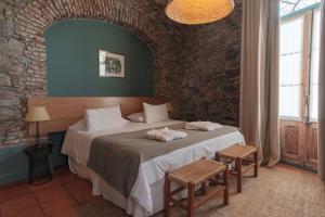 Postel nebo postele na pokoji v ubytování Posada Plaza Mayor