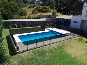 an overhead view of a swimming pool in a yard at Condominio del Faro - Quequen in Necochea