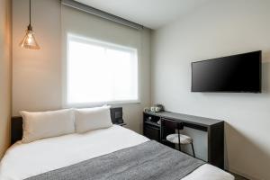 Televiisor ja/või meelelahutuskeskus majutusasutuses M's Hotel Kyoto Station Kasuga