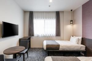 Televiisor ja/või meelelahutuskeskus majutusasutuses M's Hotel Kyoto Station Kasuga