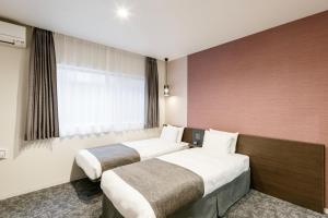 Voodi või voodid majutusasutuse M's Hotel Kyoto Station Kasuga toas