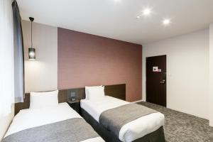 Voodi või voodid majutusasutuse M's Hotel Kyoto Station Kasuga toas