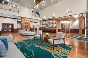 a lobby with couches and chairs on a rug at Lucky Eagle Casino & Hotel (Washington) in Rochester