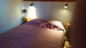a bedroom with a bed and a table with a mirror at St Gervais, Home With A View; 3 Beds, Pkg, Central in Saint-Gervais-les-Bains
