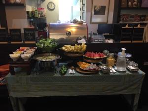 a table with many different types of food on it at iuDia Hotel in Phra Nakhon Si Ayutthaya