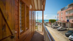 a balcony of a building with a view of a street at Résidence VWAL O VAN 2, studio plage à proximité in Sainte-Anne +16 photos