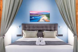 Postel nebo postele na pokoji v ubytování Regenta Inn Palacio De Goa, Panjim + 26 fotografií