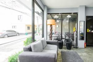 a living room with a couch and a table at Super OYO 495 The Pocket Hotel in Mactan