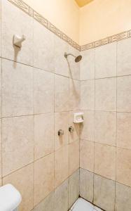 a bathroom with a shower with a toilet at Hotel Esperanza, Oaxaca Centro in Oaxaca City