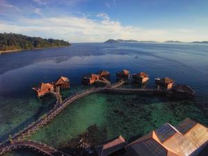 an aerial view of a resort in the water at Gayana Marine Resort in Gaya Island