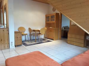 a kitchen with a table and chairs in a room at Mosel Panorama in Zell an der Mosel
