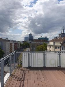 a view of a city from a balcony at Studiotel TOP LOFT in Düsseldorf