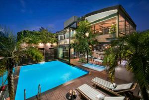 an aerial view of a house with a swimming pool at La Casa Hanoi Hotel in Hanoi