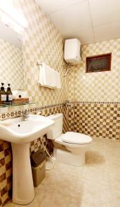 a bathroom with a toilet and a sink at Thanh Thao Dalat Hotel in Da Lat