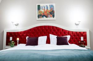 Postel nebo postele na pokoji v ubytování Grand Hotel Traian