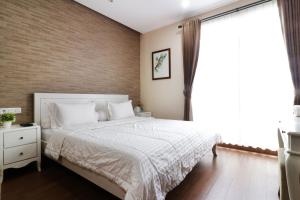 Postel nebo postele na pokoji v ubytování Jayagiri Guesthouse By Belgareti