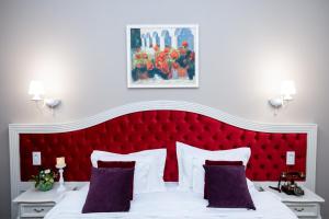Postel nebo postele na pokoji v ubytování Grand Hotel Traian