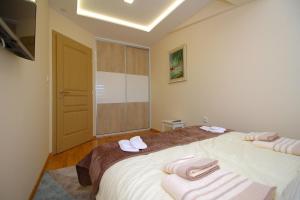 Cama ou camas em um quarto em Apartman Vip Aleksa Zlatibor Centar