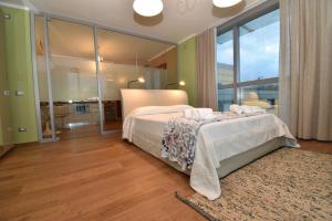 Säng eller sängar i ett rum på Sardegna é - BApartments
