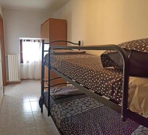 Postel nebo postele na pokoji v ubytování La Rotonda apartments by Gardadomusmea