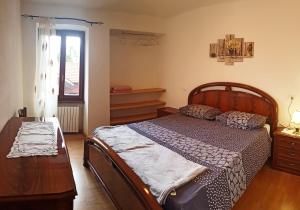 Postel nebo postele na pokoji v ubytování La Rotonda apartments by Gardadomusmea