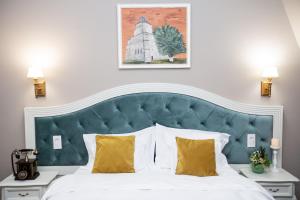 Postel nebo postele na pokoji v ubytování Grand Hotel Traian