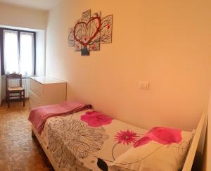 Postel nebo postele na pokoji v ubytování La Rotonda apartments by Gardadomusmea