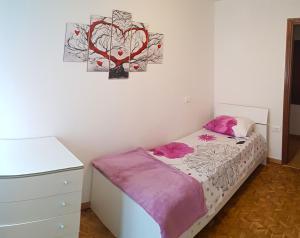 Postel nebo postele na pokoji v ubytování La Rotonda apartments by Gardadomusmea